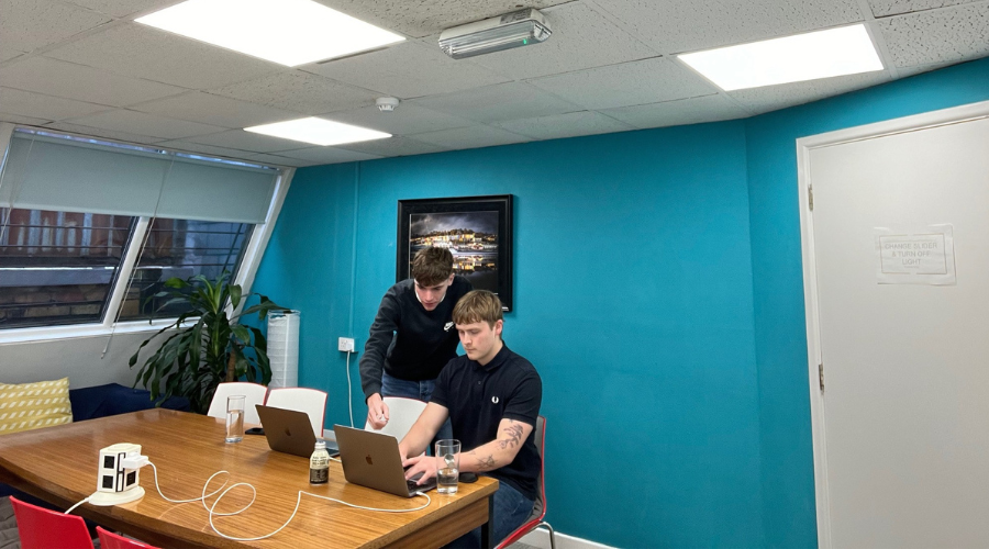 luke and harry working in the handl agency office